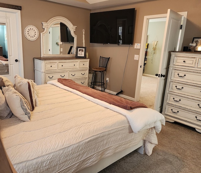 carpeted bedroom with baseboards