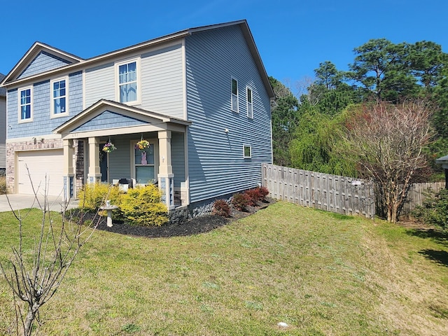 view of front facade with a garage, driveway, a front yard, and fence