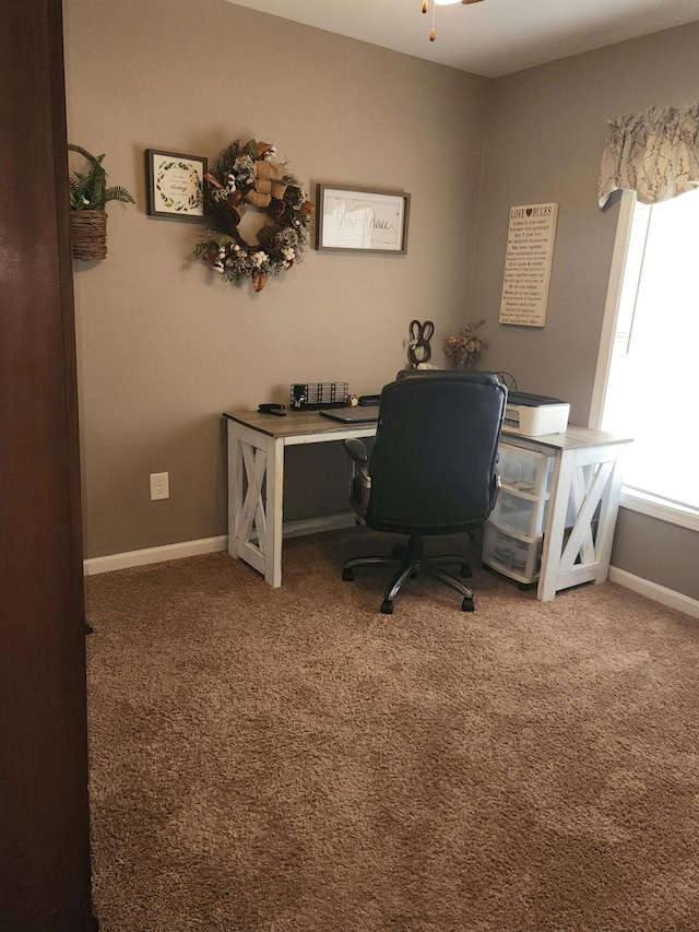 home office with baseboards, carpet, and a ceiling fan