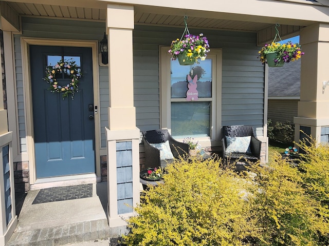 property entrance featuring covered porch