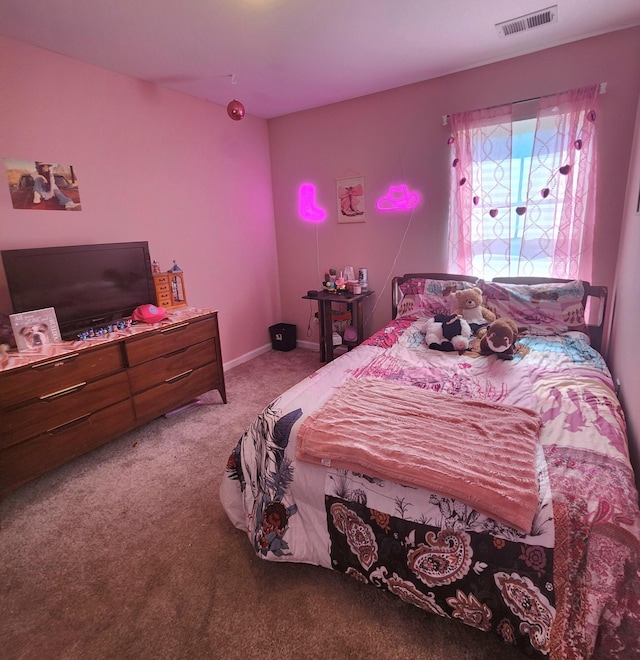 bedroom with visible vents, carpet floors, and baseboards