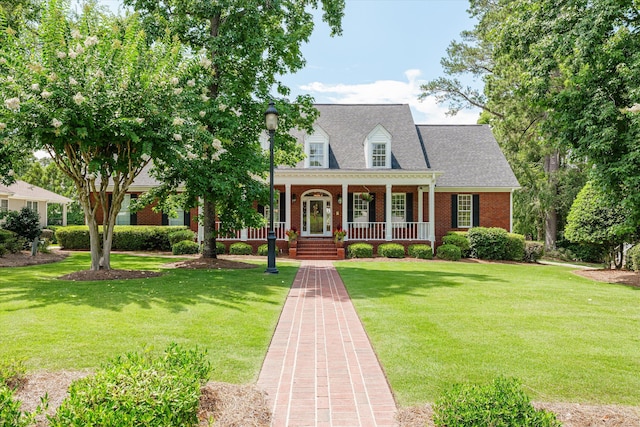 3570 Granite Way, Martinez, GA 30907 - cape cod-style house with brick siding, covered porch, a front lawn, and roof with shingles