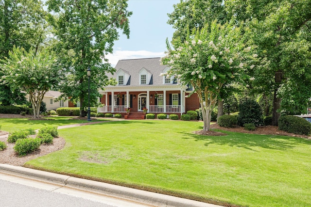 3570 Granite Way, Martinez, GA 30907 - new england style home with a porch, a front lawn, and brick siding