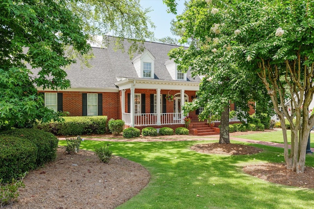 3570 Granite Way, Martinez, GA 30907 - cape cod home with covered porch, brick siding, a front yard, and a shingled roof