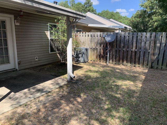 view of yard featuring a patio and central AC unit