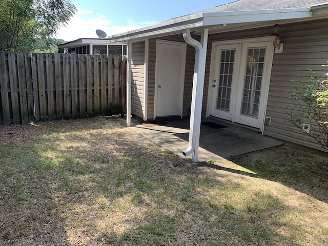 view of yard with a patio and french doors