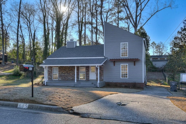 front facade with central air condition unit and covered porch