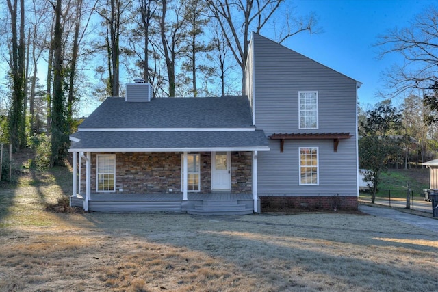 view of front of home with a front lawn and a porch