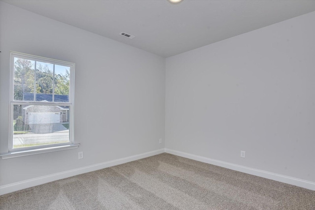 empty room featuring carpet flooring