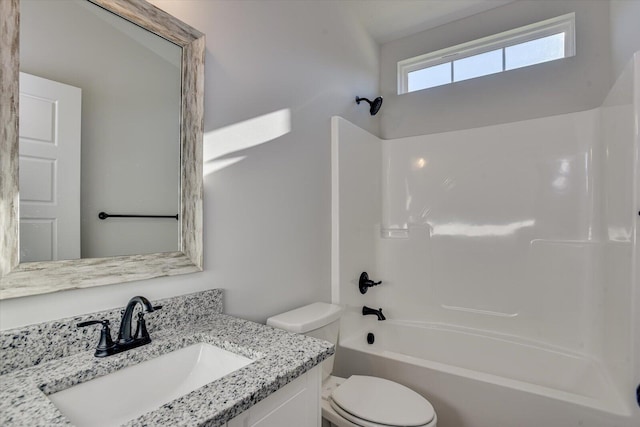 full bathroom with bathtub / shower combination, vanity, and toilet