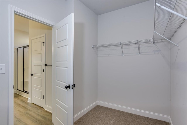 spacious closet with light wood-type flooring