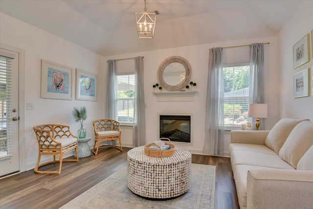 385 Bridle Path Rd, North Augusta, SC 29860 - living room with a glass covered fireplace, wood finished floors, lofted ceiling, and a chandelier