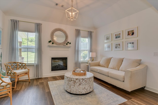 385 Bridle Path Rd, North Augusta, SC 29860 - living room with a chandelier, dark wood finished floors, a glass covered fireplace, and lofted ceiling