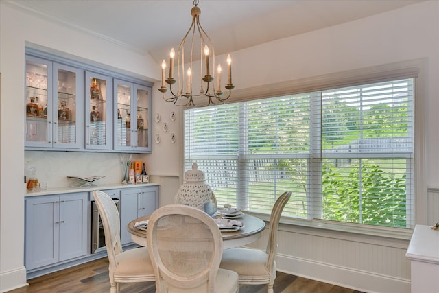 385 Bridle Path Rd, North Augusta, SC 29860 - dining area featuring wine cooler, wood finished floors, plenty of natural light, a chandelier, and ornamental molding