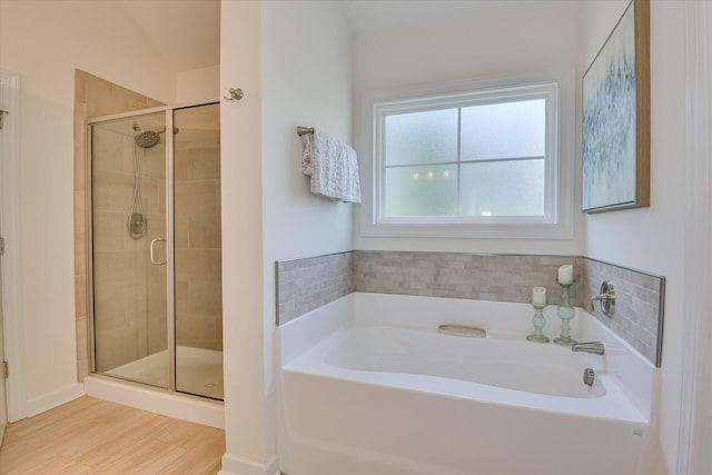 385 Bridle Path Rd, North Augusta, SC 29860 - bathroom featuring a garden tub, a stall shower, and wood finished floors