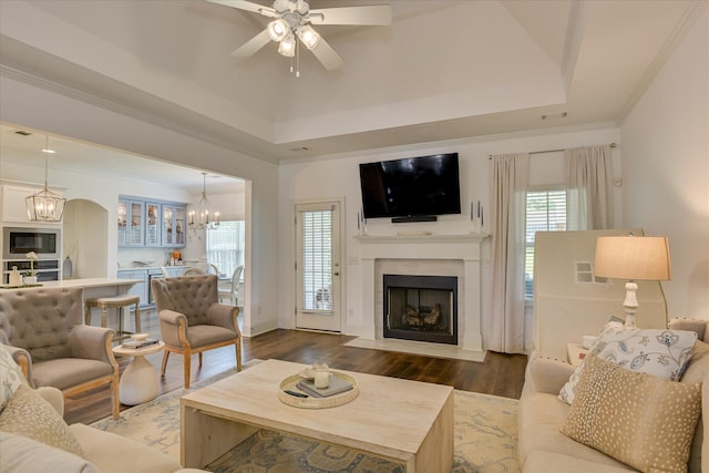 385 Bridle Path Rd, North Augusta, SC 29860 - living area with a chandelier, a fireplace with flush hearth, a ceiling fan, and dark wood-style flooring