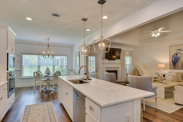 385 Bridle Path Rd, North Augusta, SC 29860 - kitchen with stainless steel appliances, a chandelier, open floor plan, a kitchen island with sink, and white cabinets