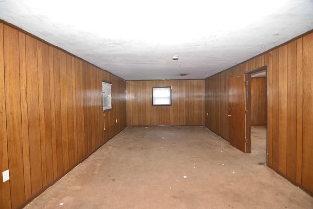 spare room featuring wooden walls