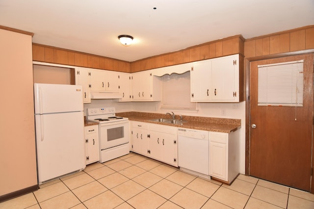 kitchen featuring dark countertops, white cabinets, a sink, white appliances, and under cabinet range hood