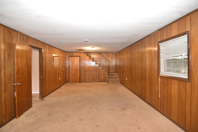 interior space with wooden walls and stairs