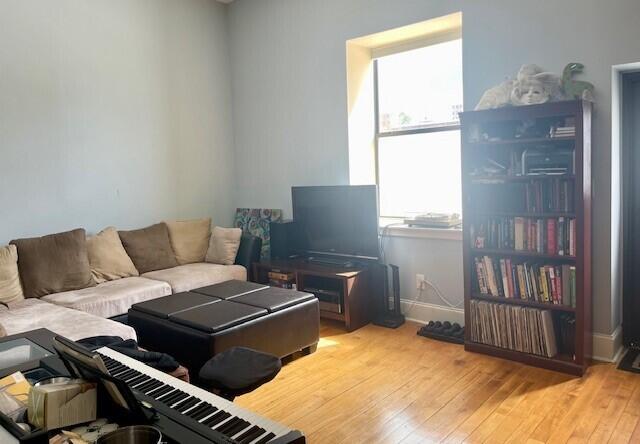 living room with light hardwood / wood-style floors