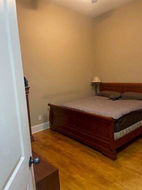 bedroom featuring ceiling fan and light hardwood / wood-style flooring