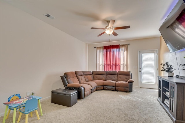 living room with carpet flooring and ceiling fan