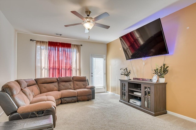 living room featuring light carpet and ceiling fan