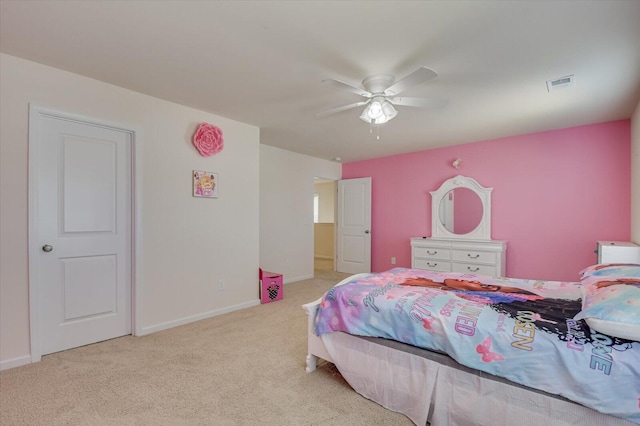 bedroom with light carpet and ceiling fan