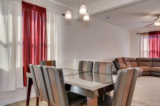 dining room with ceiling fan and light hardwood / wood-style floors