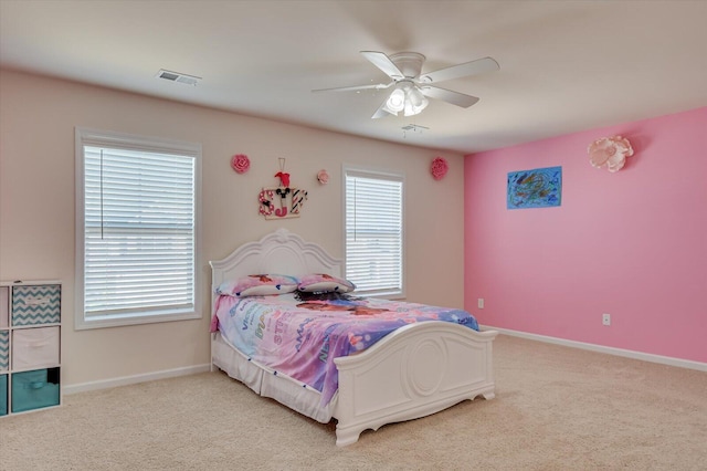 bedroom featuring ceiling fan and light carpet