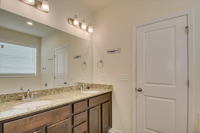 bathroom featuring a bathtub and vanity