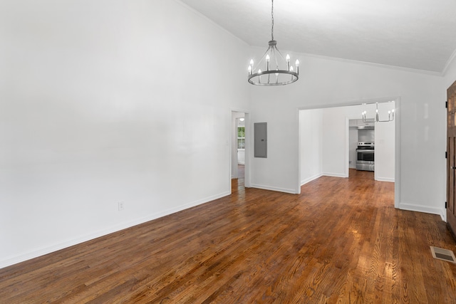411 Warren Rd, Augusta, GA 30907 - unfurnished dining area featuring a chandelier, electric panel, lofted ceiling, ornamental molding, and dark wood-style floors