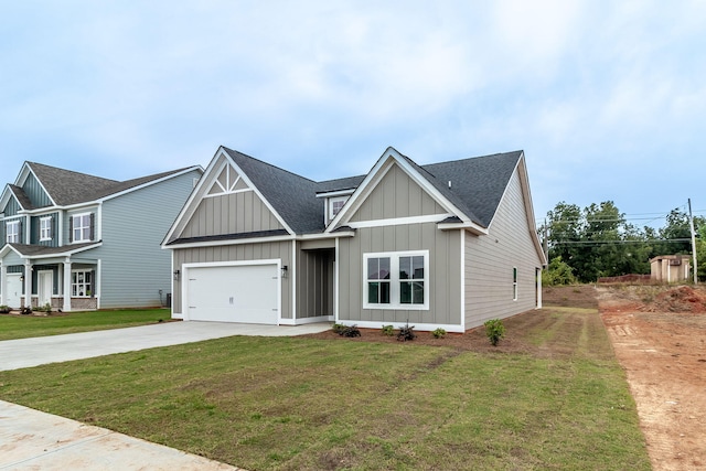 view of front of house with a garage and a front lawn