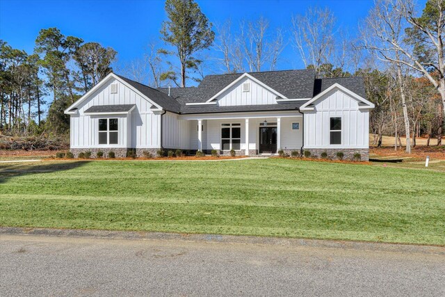 view of side of home with a lawn and a garage