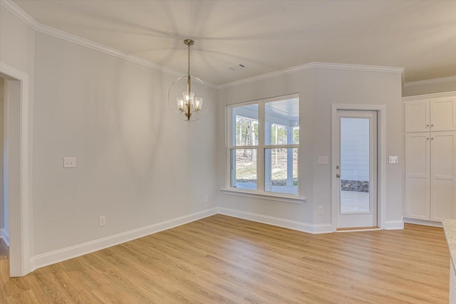 unfurnished room with ornamental molding, light hardwood / wood-style flooring, and a notable chandelier