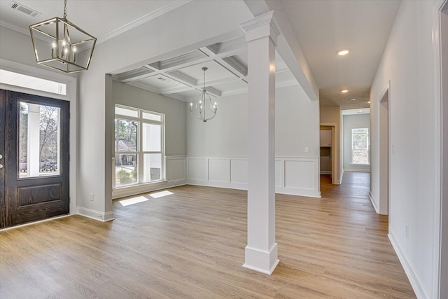 entryway featuring coffered ceiling, light hardwood / wood-style floors, and a notable chandelier