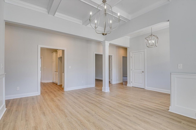 empty room with a notable chandelier, ornate columns, beamed ceiling, and light wood-type flooring