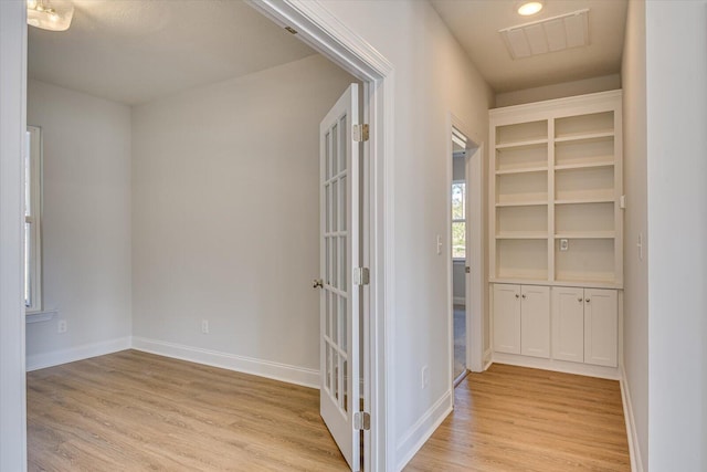 corridor featuring light hardwood / wood-style flooring