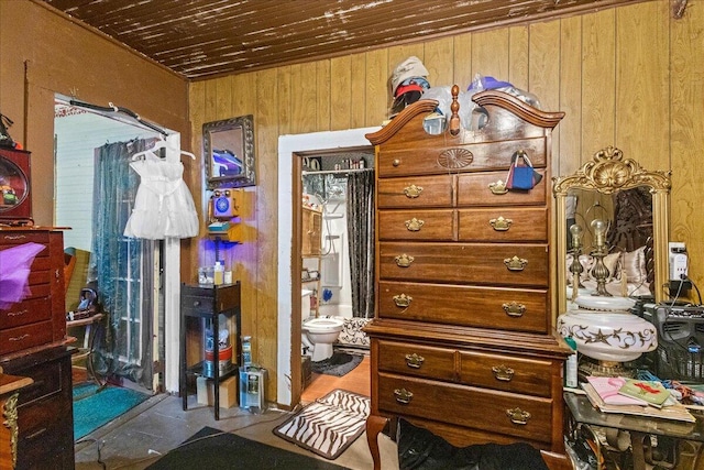 misc room featuring wood ceiling and wooden walls