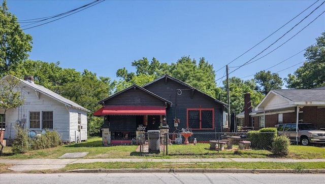 bungalow with a front yard