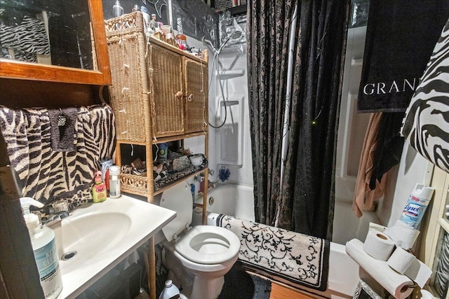 full bathroom featuring shower / tub combo, toilet, and sink