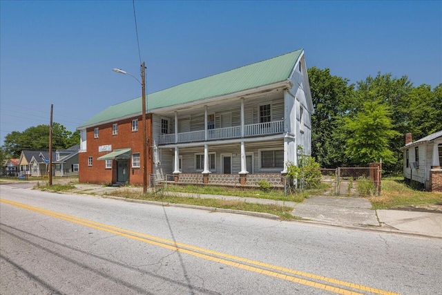 view of front of home with a balcony