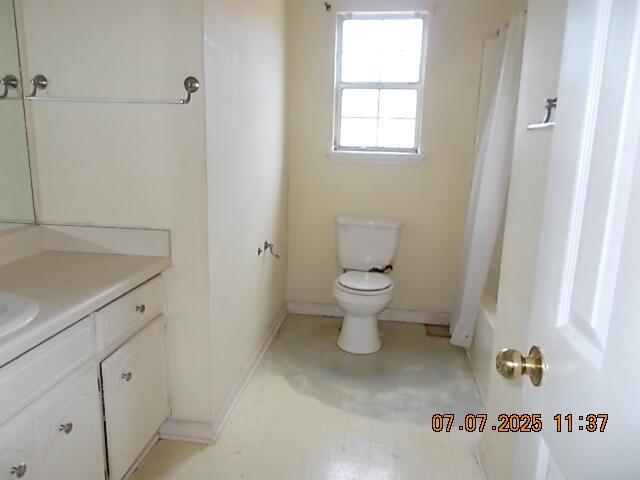 3938 Crest Dr, Hephzibah, GA 30815 - full bathroom featuring vanity, shower / bathtub combination with curtain, and tile patterned floors