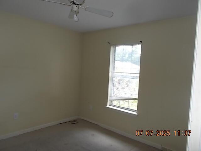3938 Crest Dr, Hephzibah, GA 30815 - spare room with baseboards and a ceiling fan