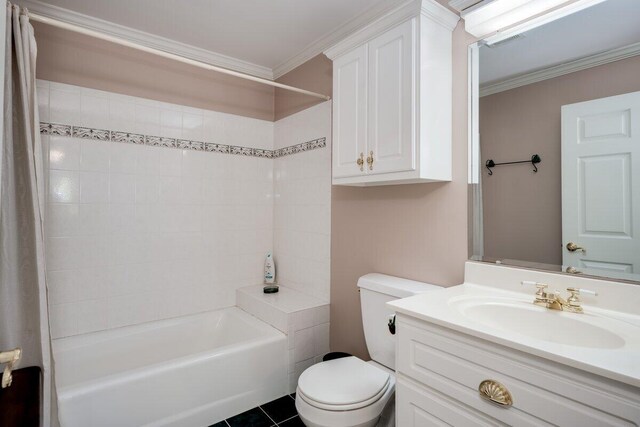 full bathroom featuring vanity, tiled shower / bath combo, ornamental molding, and toilet