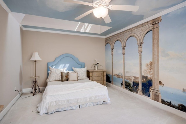 carpeted bedroom featuring ornamental molding and ceiling fan