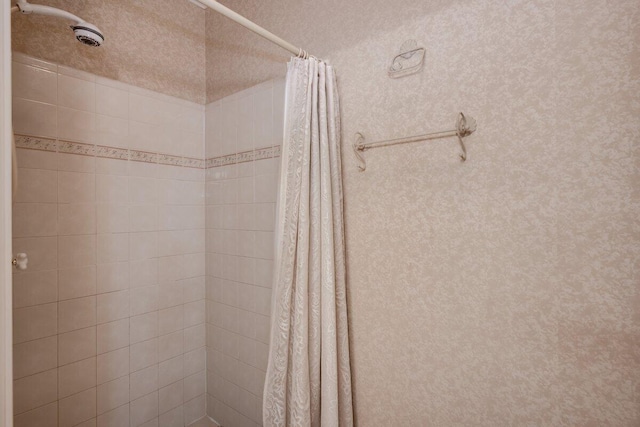 bathroom with a shower with shower curtain