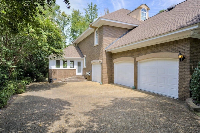 view of side of home featuring a garage