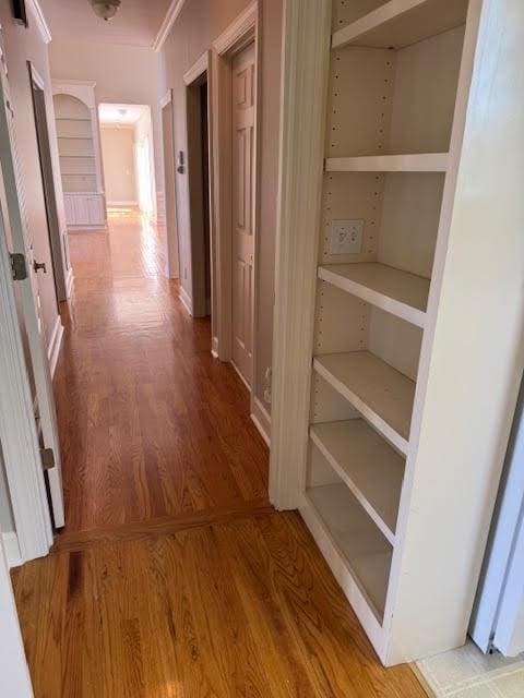 corridor with wood-type flooring